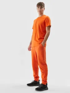 Pánske teplákové nohavice typu jogger - oranžové