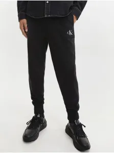 Bavlnené tepláky Calvin Klein Jeans pánske, čierna farba, jednofarebné #582760