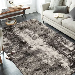 Brilatný béžovo hnedý koberec s jemným abstraktným motívom