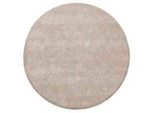Moderný okrúhly koberec v béžovej farbe