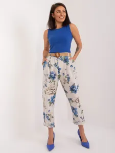 Light beige fabric trousers with a floral print