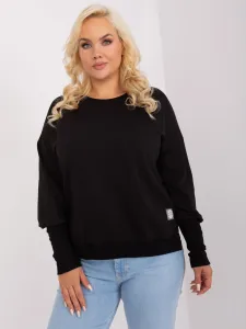 Black oversized blouse with cuffs on the sleeves