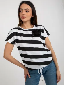 Lady's black and white striped blouse with flower