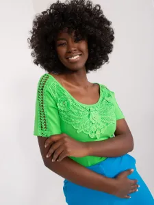 Light green blouse with lace and appliqué