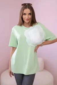 Cotton blouse with a decorative flower of light green color