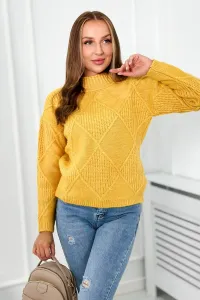 Diamond mustard sweater draped over the head