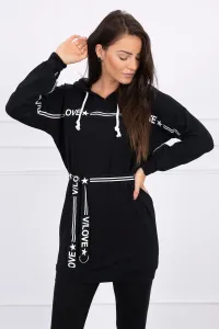 Dress decorated with a tape with black inscriptions