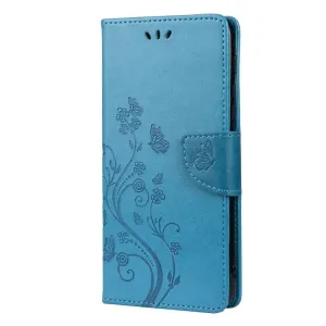 Peňaženkové puzdro Embossing Pattern Motýľ a kvet modré – Motorola Moto G30 / G10