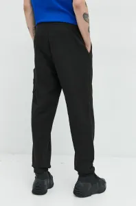 Bavlnené tepláky Tommy Jeans pánske, čierna farba, jednofarebné
