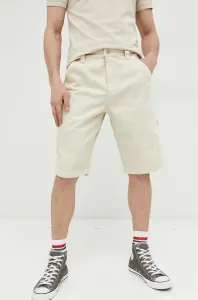 Rifľové krátke nohavice Tommy Jeans pánske, béžová farba